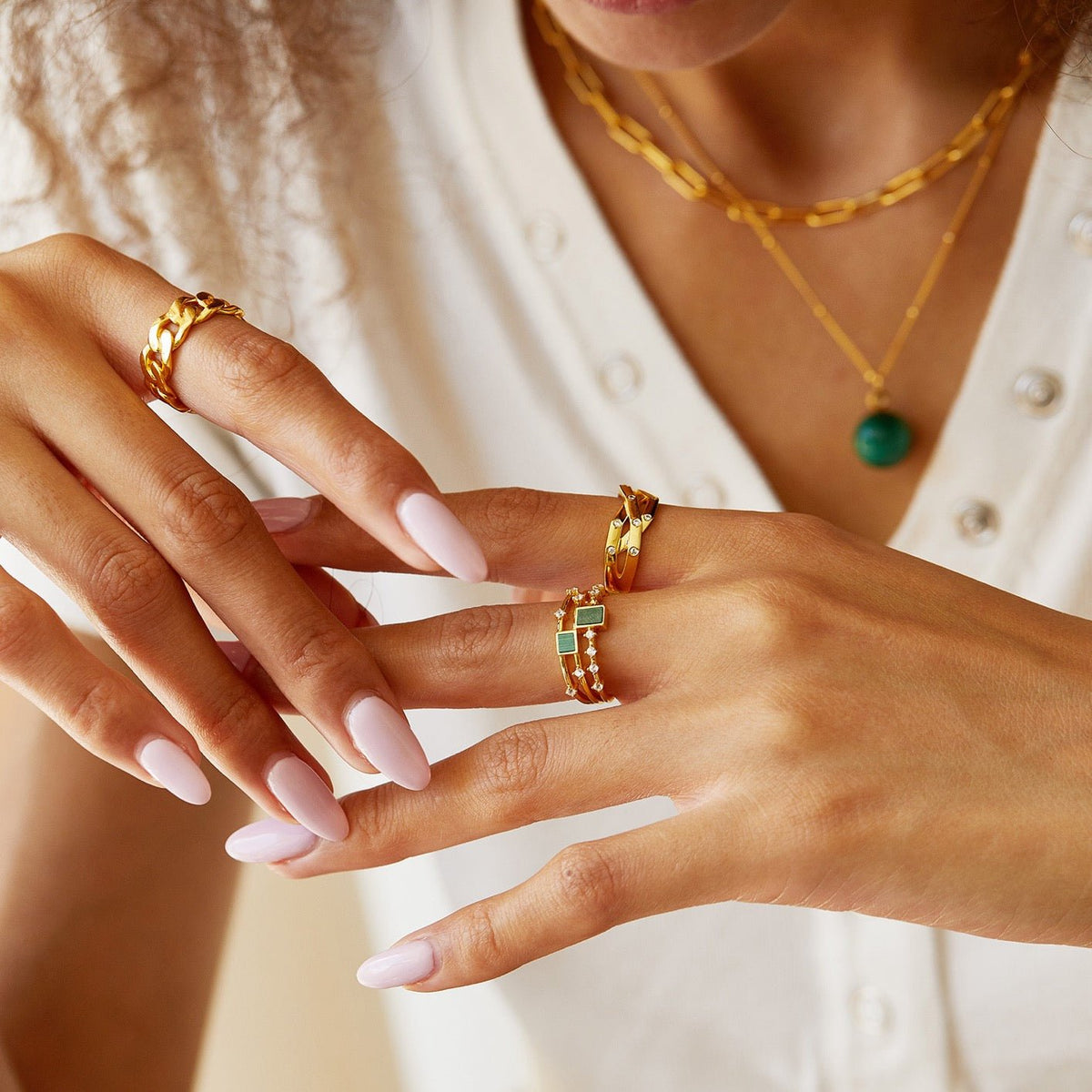 Paris brand Awakened Time luxury jewelry styled with a gold vermeil ring and pendant necklace.