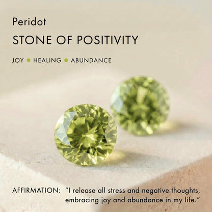 Awakened Time Peridot gemstone infographic featuring two faceted green stones with text highlighting it as the stone of positivity, joy, healing, and abundance.