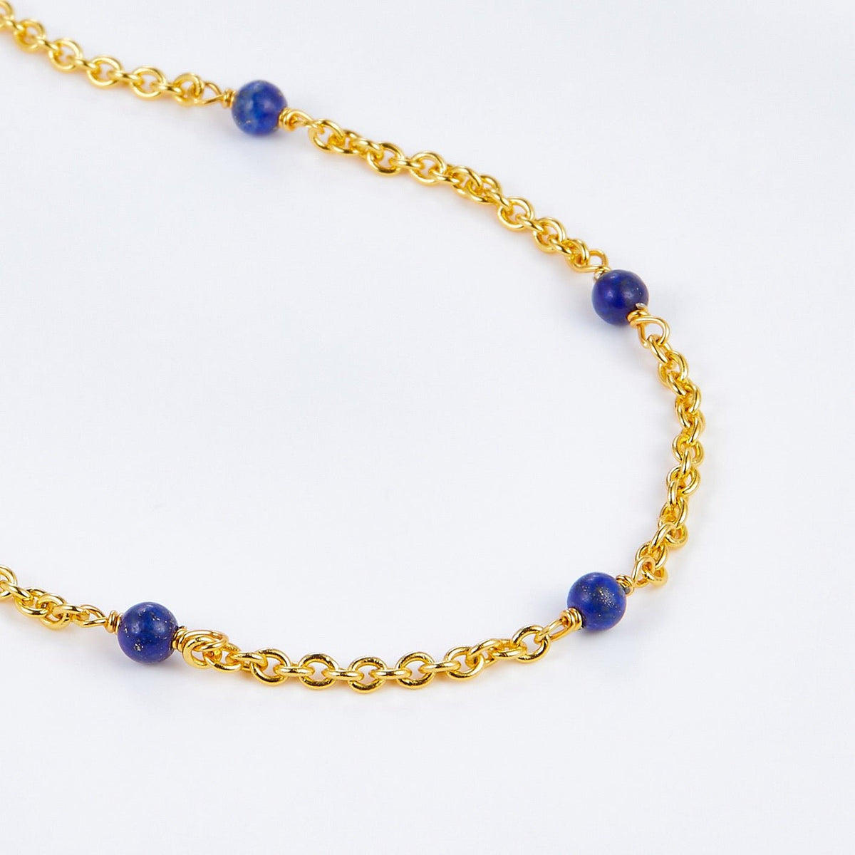 Delicate gold vermeil chain necklace accented with blue lapis lazuli beads
