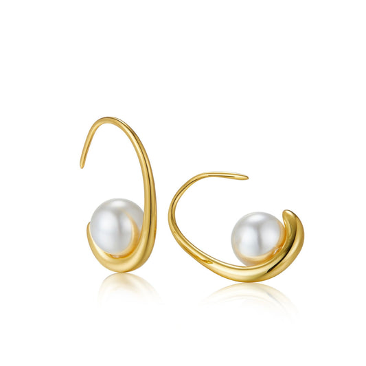 Pair of gold arc hoop earrings crafted in 18ct gold vermeil featuring cradled freshwater pearls on a white background.