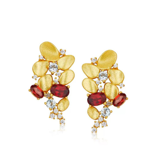 Pair of Opéra de Feu cascade earrings in 18ct gold vermeil with natural red garnets on a white background.