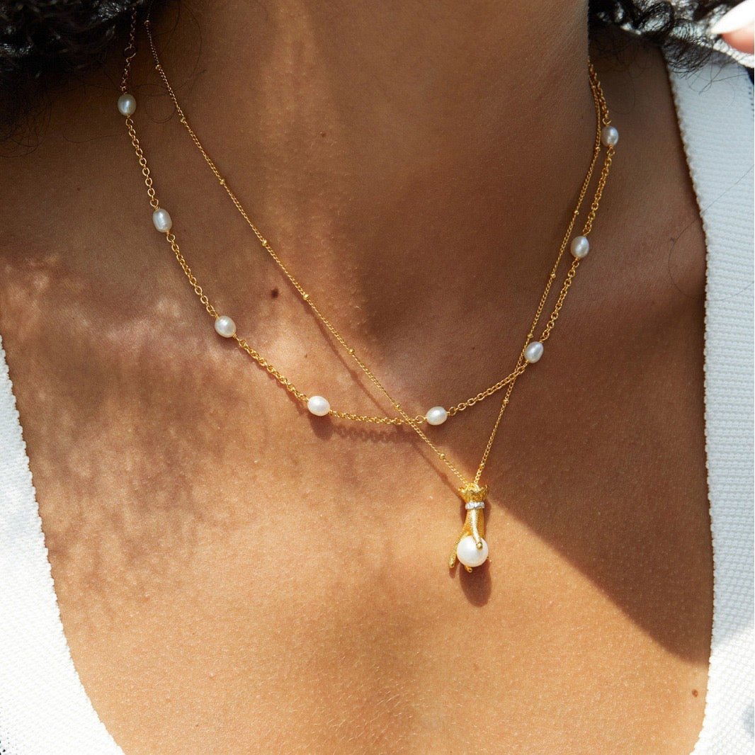 Pearl in Palm Necklace