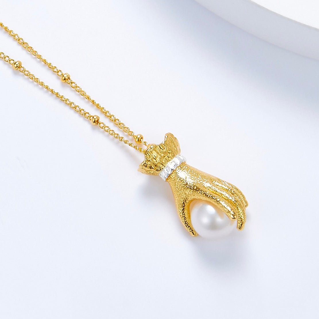 Pearl in Palm Necklace
